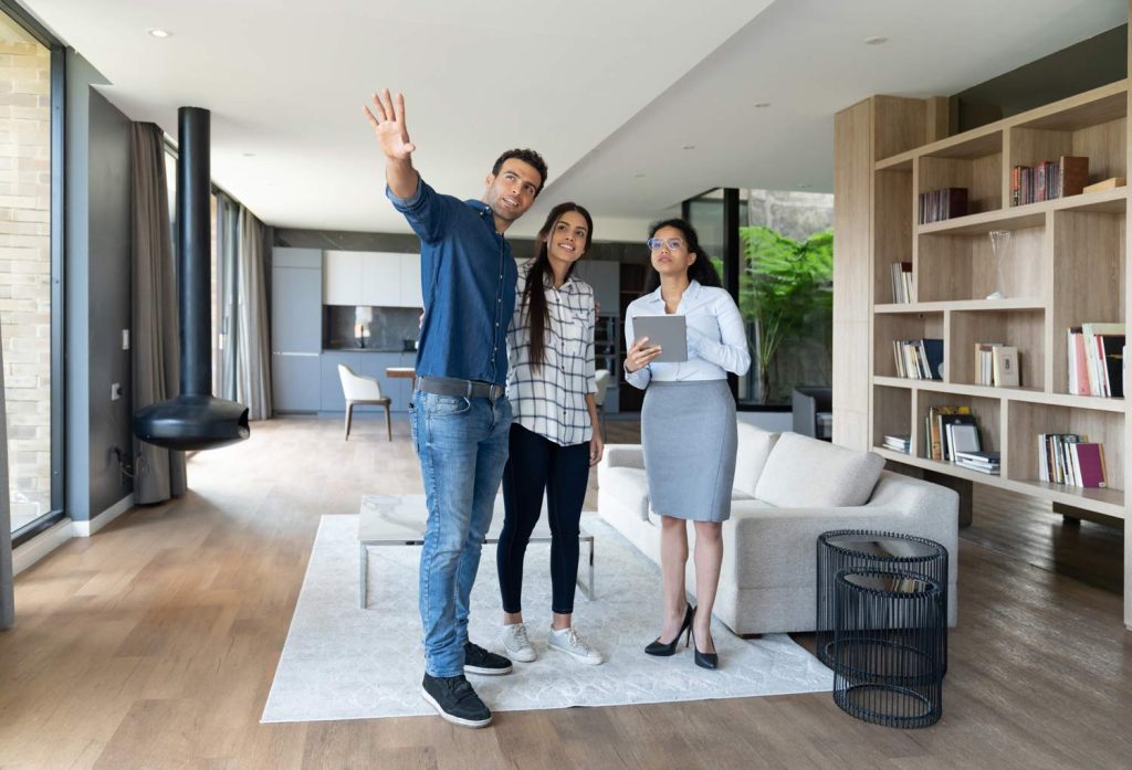 Real estate agent showing a home to buyers